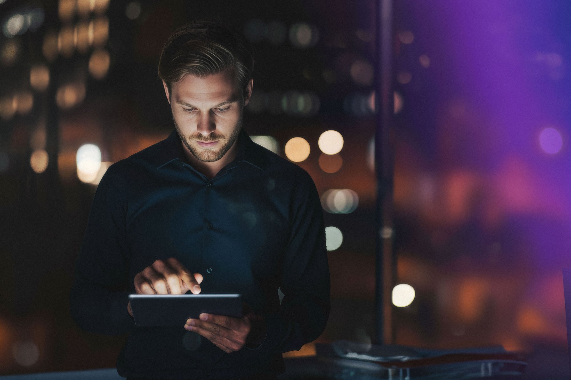 Man-working-with-surfpad-at-night
