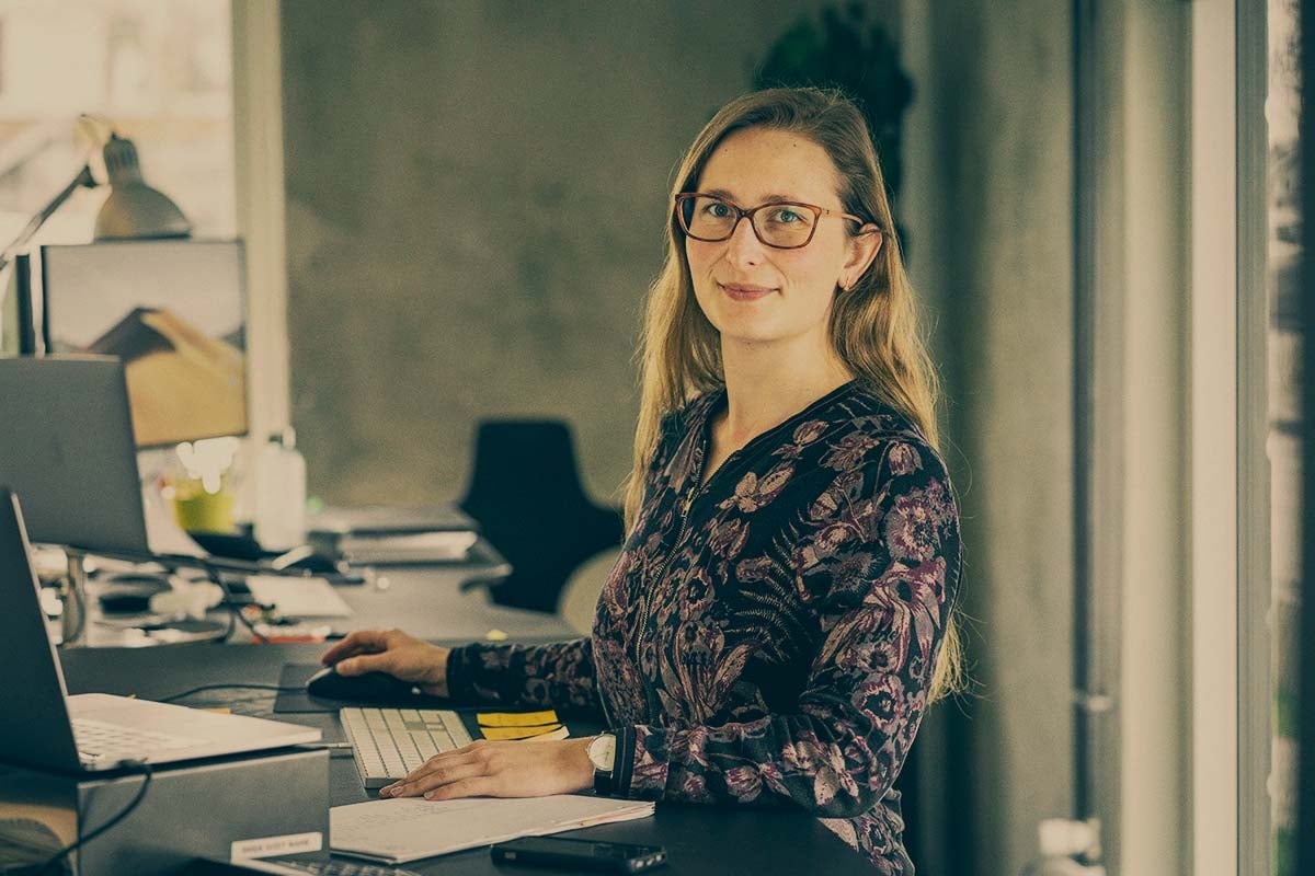 Woman-standing-by-the-desk
