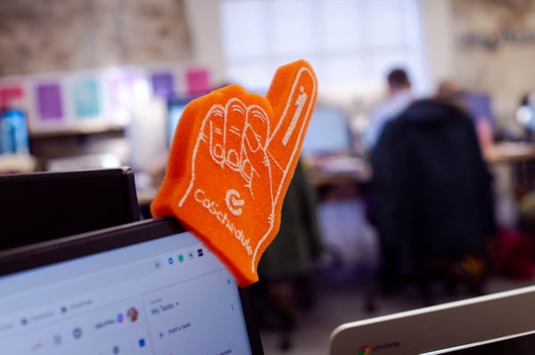 [Blog 3] - coschedule foam finger with core values in background