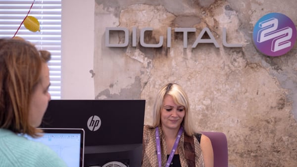 Danielle with Digital 22 sign