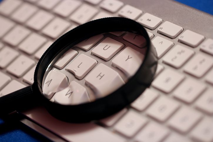 magnifying glass on a keyboard