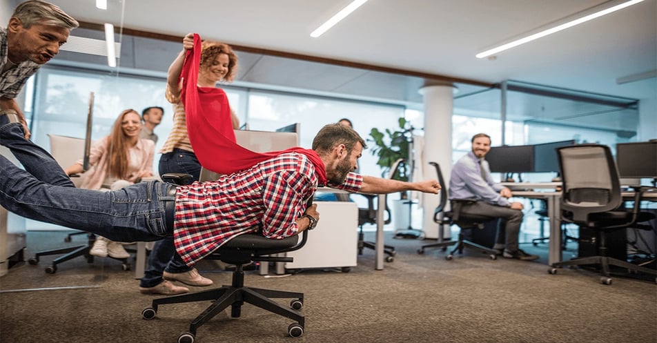 superman-pose-slide-on-office-chair-cape