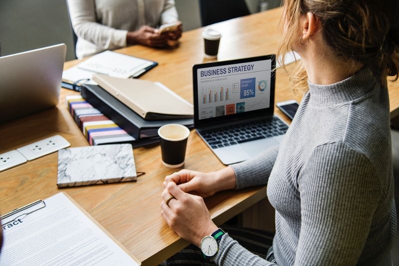 woman-sitting-by-computer-business-strategy